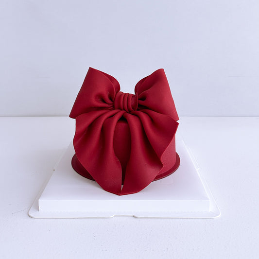 Red bow-shaped cake , auckland cake 