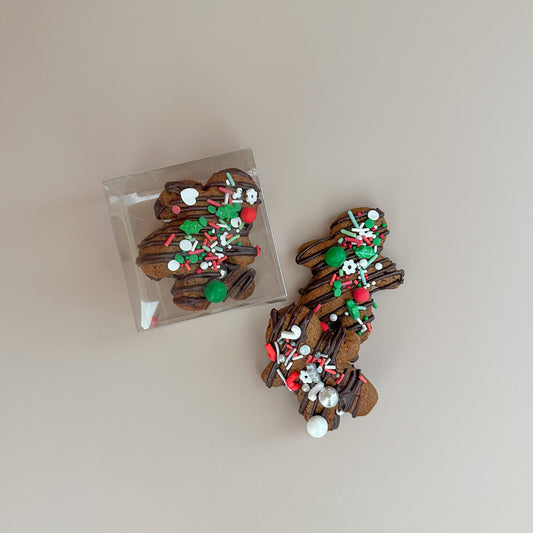 Decorative hair clips with Christmas-themed embellishments on a light background