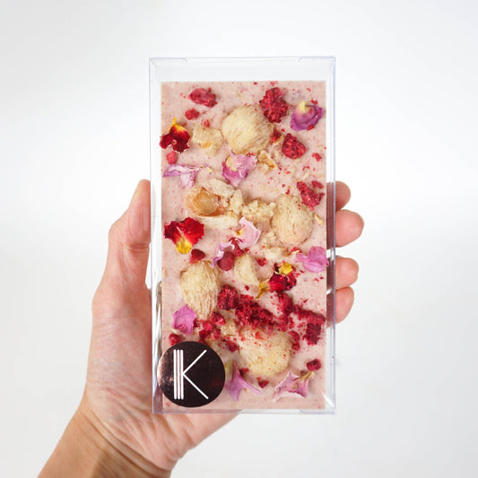 White chocolate bar with freeze dried raspberry, lychee and rose